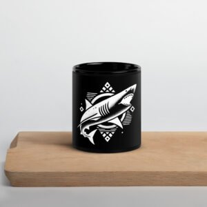 A minimalist, tattoo-style shortfin mako shark, depicted in motion with clean, flowing lines. The design embodies the speed and elegance of this North Atlantic predator, tying it to the coastal waters of the British Isles.